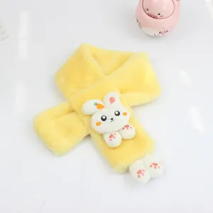 Macro detail of plush yellow kids scarf featuring a 3D bunny ornament and soft carrot embroidery