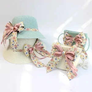 Stroh-Sonnenhut und Taschen-Set für Kinder mit Blumenbändern und rosa Schleifen