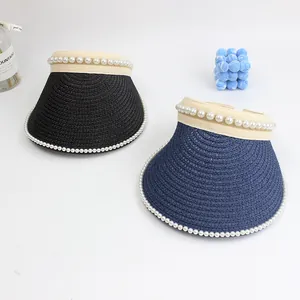 Women straw sun visor hats with pearl trim in black and navy blue on white background