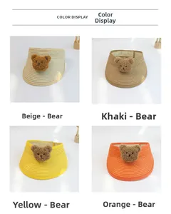 Color display of woven sun visor hats for kids featuring cute plush bear patches