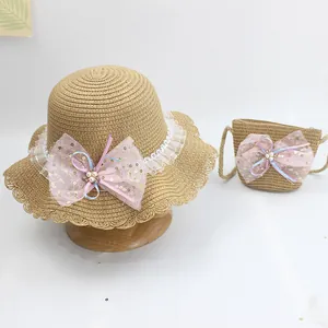 Detailed set of straw sun hat and matching bag with mesh bow and pearls for girls