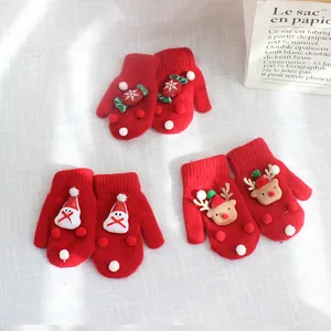 Thick red Christmas knitted mittens with Santa Claus and reindeer designs for winter warmth