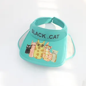 Close-up of mint green sun hat with cartoon cat prints and breathable mesh lining