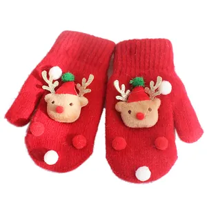 Winter red knitted Christmas mittens for kids with 3D reindeer and plush pompom decor