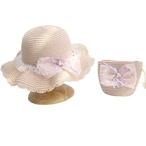 Pink straw sun hat and matching handbag set with lace bows and pearl accents for girls