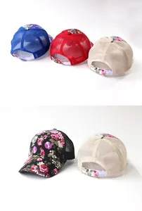 Detailed view of floral mesh baseball caps with adjustable velcro straps in multi-colors