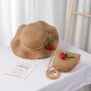 Kids straw sun hat and matching crossbody bag set with red cherry decor for summer travel
