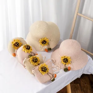 Summer kids straw hat and matching bags set with sunflowers and colorful pom-poms decor