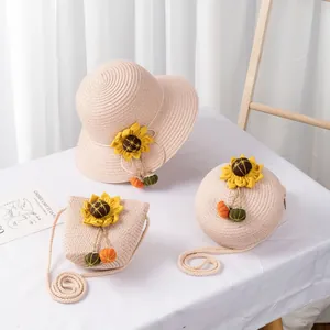 Detail of straw hat and matching bags set featuring yellow sunflowers for kids
