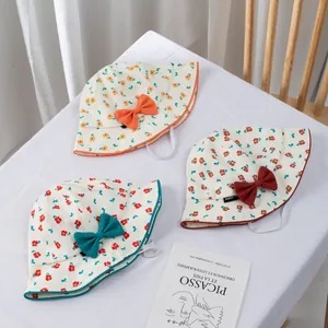 Floral cotton sun hats for baby girls with cute decorative bows and windproof chin straps
