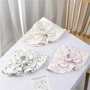 Floral baby sun hat with large bow decoration in yellow green and pink cotton fabric