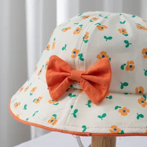 Baby girl floral sun hat with orange bow and small flower patterns for spring and summer