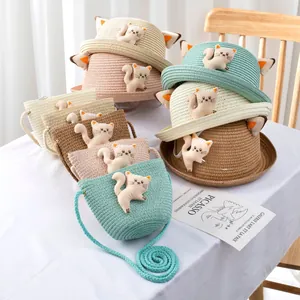 Detail of straw hat and bag set with cute cat ear design for kids in various colors