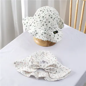 Girls floral sun hats in pink and green with bow detail and wide brim for sun protection