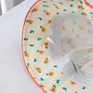 Floral print baby sun hat with mesh lining and adjustable chin strap for toddlers