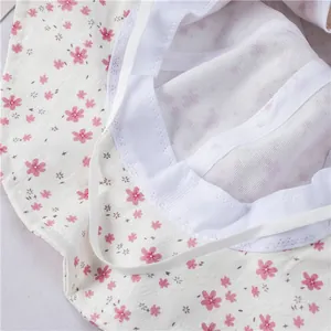 Floral baby girl sun hat with wide brim, mesh lining and elastic chin strap