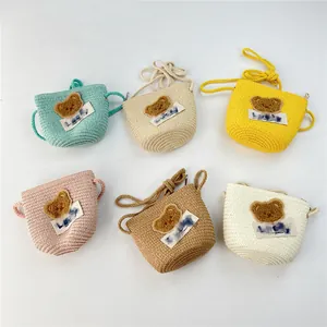 Close-up of children's woven bags with bear patches and Lucky labels in six colors