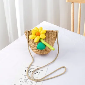 Detail of handmade straw bag with vibrant yellow sunflower and zipper closure