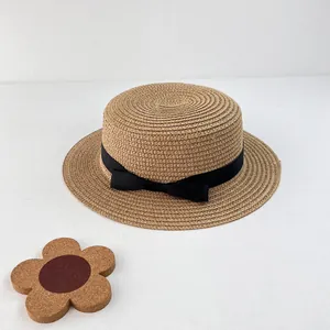 Women's summer straw flat top boater hat with a black ribbon bow in khaki finish