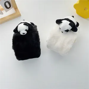 Detailed view of plush phone case featuring soft faux fur and 3D panda doll ornaments