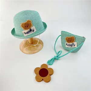 Matching mint green kids straw sun hat and crossbody bag set with bear patch