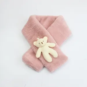 Detail of soft pink faux rabbit fur scarf with a 3D plush bear ornament for children