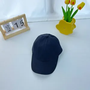 Close-up of a classic black cotton baseball cap on a stylish tabletop background