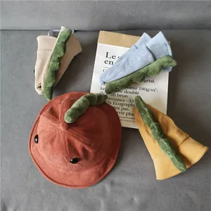 Cute kids corduroy dinosaur bucket hats in orange, yellow, blue and beige colors
