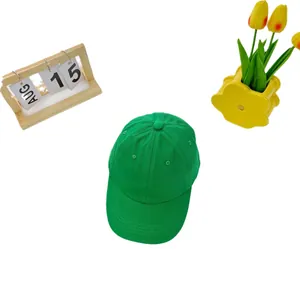 Classic bright green cotton baseball cap for kids with curved brim on white background