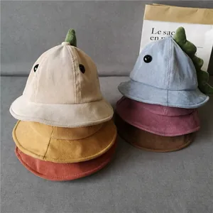 Detail of children corduroy dinosaur bucket hats in six vibrant assorted colors