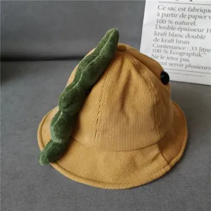 Kids yellow corduroy bucket hat featuring a cute green dinosaur design and plush fin
