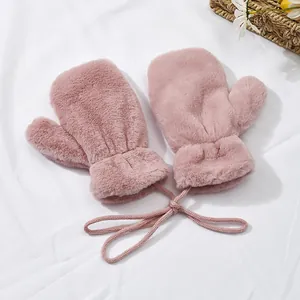 Detailed view of pink plush toddler mittens with thick fleece lining and hanging neck rope