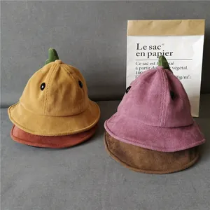 Close-up of corduroy children's bucket hats with cute dinosaur spines in multiple colors