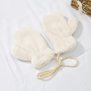 Detail of cream plush mittens featuring warm faux rabbit fur and anti-lost neck string