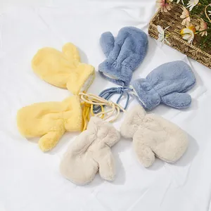 Thick plush winter mittens for kids with neck strings in yellow, blue and white colors
