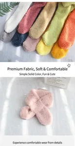 Detailed close-up of soft lamb fleece children's scarves in various pastel colors
