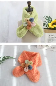 Detail of plush lamb wool kids' scarf with soft 3D colorful floral ornament
