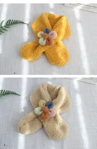 Detailed close-up of soft lamb wool scarves with colorful 3D flower accents for kids