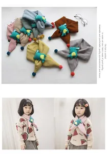 Detailed view of children's knitted scarves with cartoon dinosaur plush and pom-poms in 6 colors