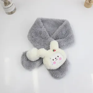 Detail of plush grey rabbit fur scarf with cute white bunny head and strawberry accent