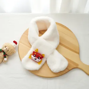 Detail of white plush scarf featuring a red and yellow cartoon dragon patch design
