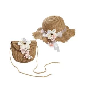 Summer straw sun hat and matching flower crossbody bag set with elegant wavy edges