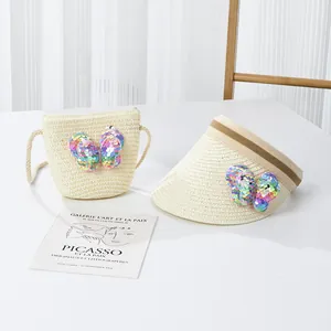 Détail de l'ensemble chapeau de paille et sac bandoulière avec nœuds en paillettes pour filles