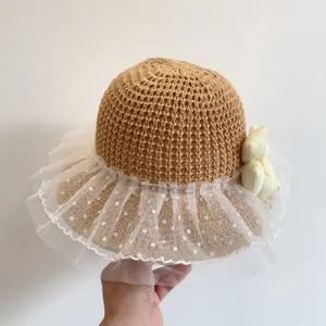 Child summer straw hat with white polka dot lace brim and yellow flower accent
