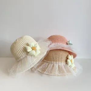 Straw sun hats for girls with polka dot lace trim and floral accents for summer beach trips