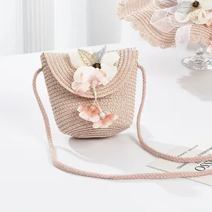 Cute girls straw crossbody bag with flower decor and beads for beach outings and travel