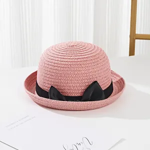 Pink straw sun hat for girls with black bow ribbon and stylish curled brim for summer
