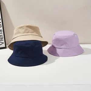 Detailed texture of cotton canvas bucket hats in khaki, navy blue and light purple