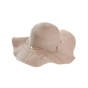 Elegant wide brim straw sun hat with pearl bow detail for women's summer vacation
