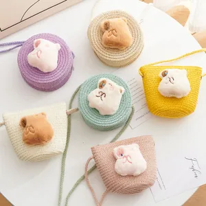 Kids colorful straw crossbody bags with cute plush animal heads in various soft pastel colors